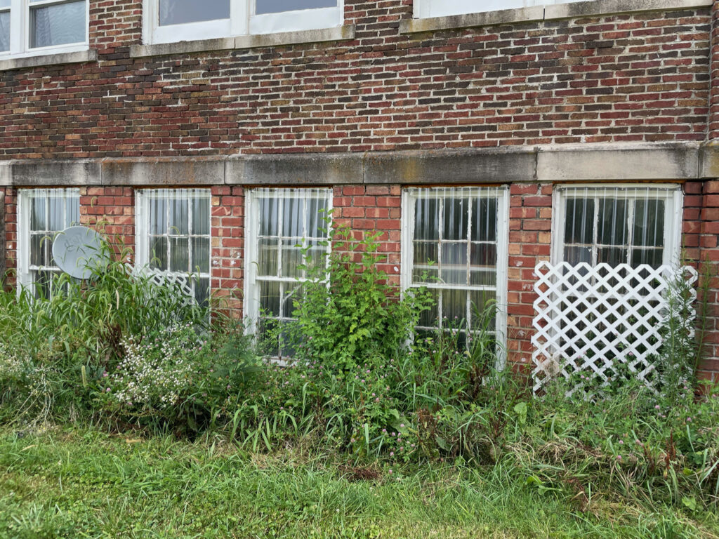 outside of old schoolhouse before renovations