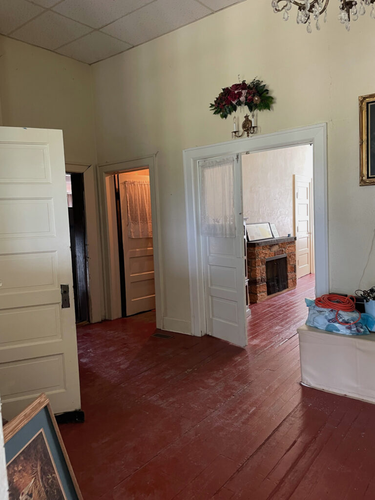 inside hallway of old schoolhouse before renovations